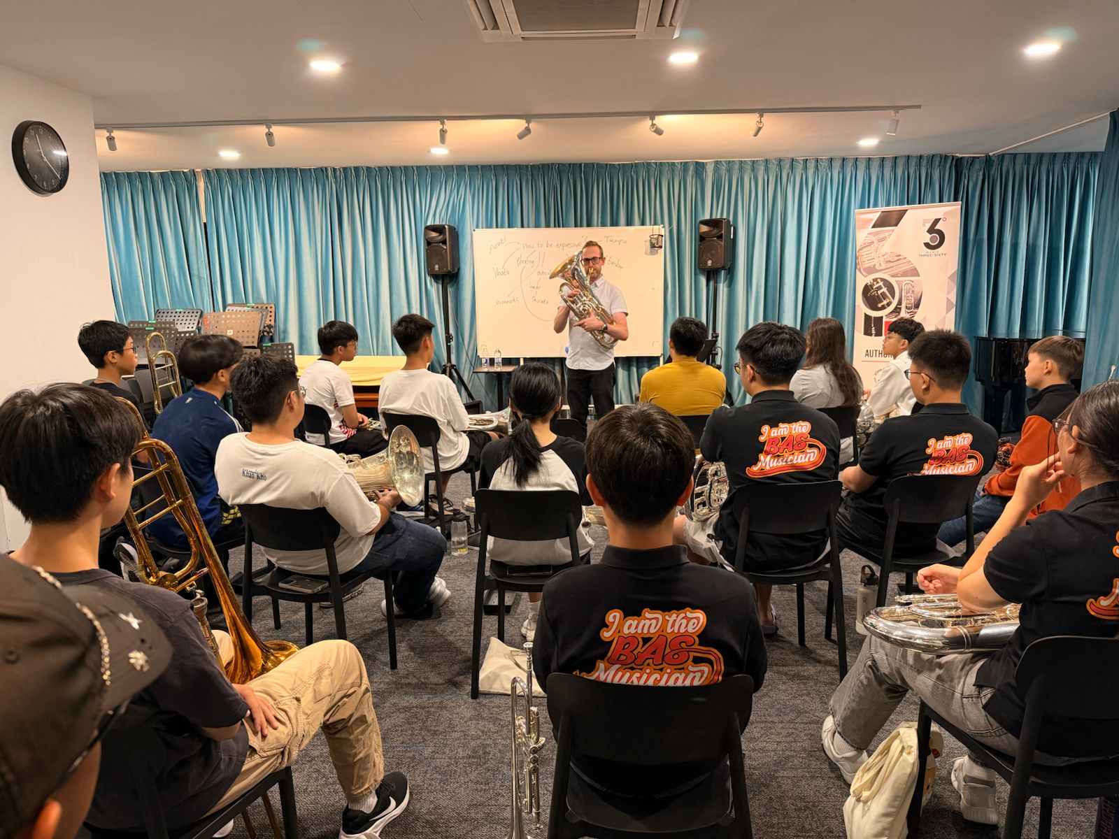 Students listening closely during a session at the BAS studio