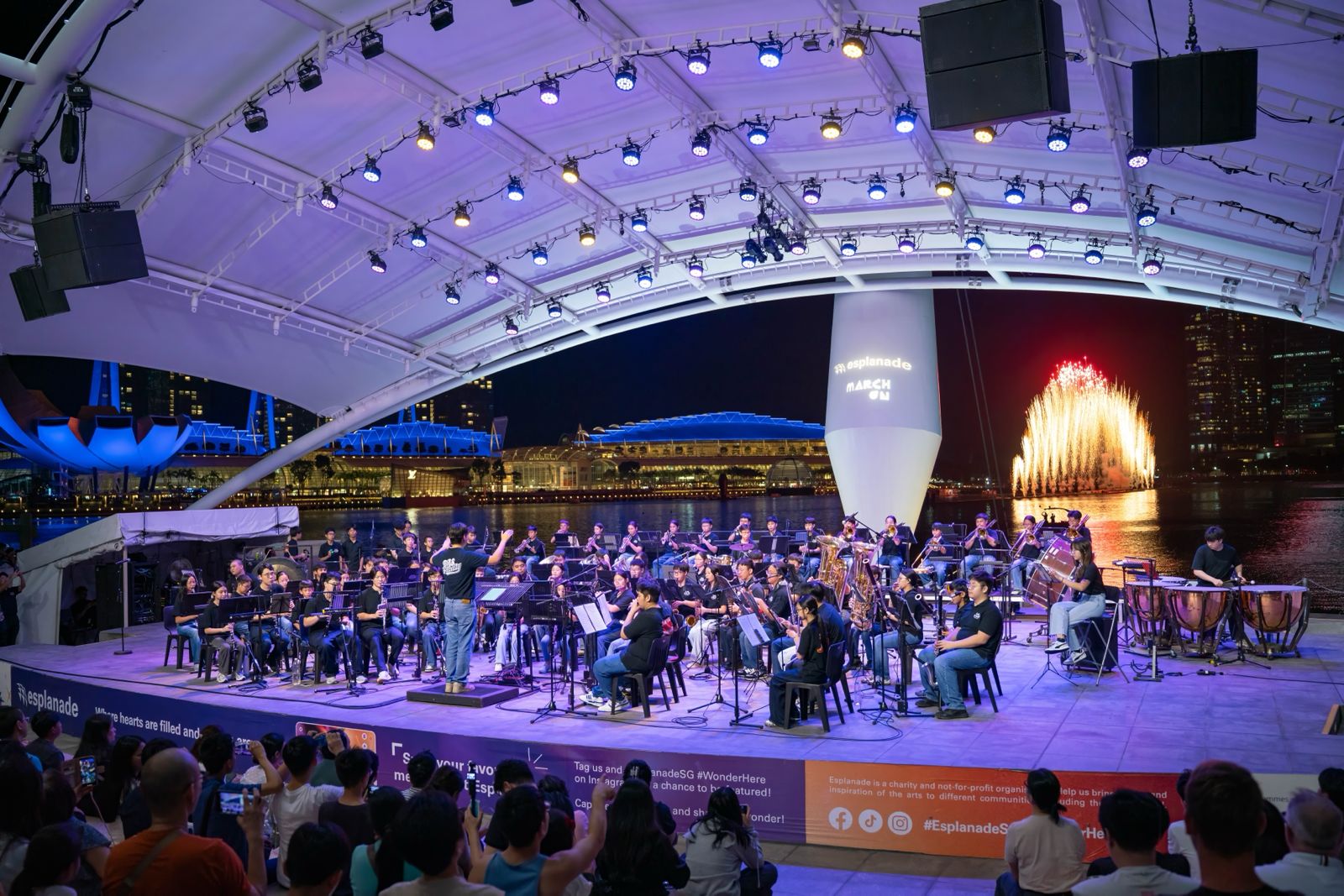The BAS Ensemble performing at the Esplanade outdoor theatre at night