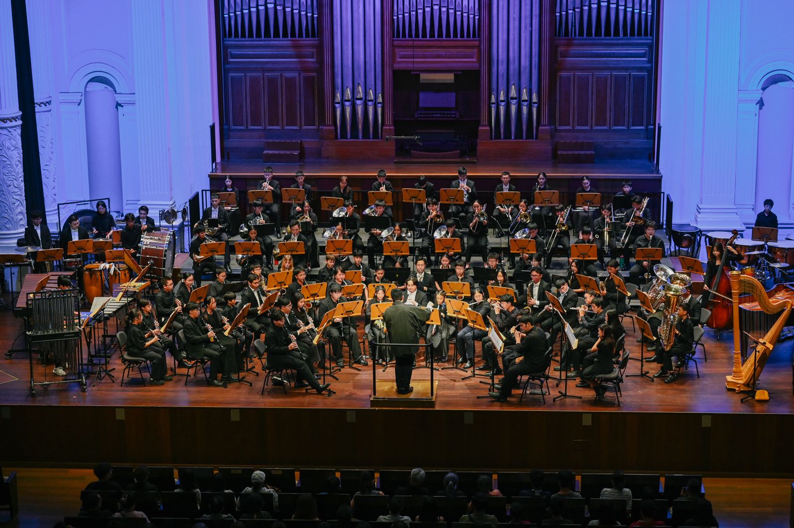 A large youth wind band performing at Victoria Concert Hall